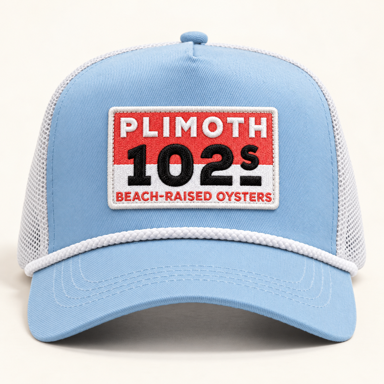 Light blue Plimoth 102s patch trucker hat