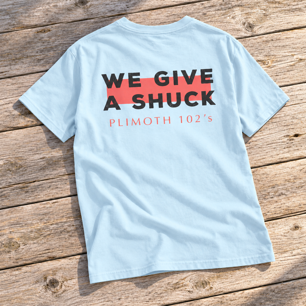 Back of the sage green Plimoth 102s We Give a Shuck T-shirt